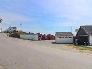 a dirt road with houses on the side of a street at Holiday Home Gudmand - 600m from the sea in Bornholm by Interhome in Vester Sømarken