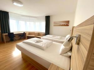 מיטה או מיטות בחדר ב-Limok Rooms Hamm