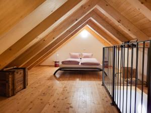 a bedroom with a bed in the attic at Holiday Home Cà dal Leo by Interhome in Bignasco