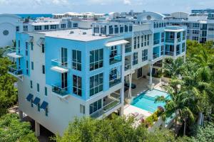 an aerial view of a building with a swimming pool at Coastal Condo Deerfield Beach Retreat 3 bed 2 bath in Deerfield Beach