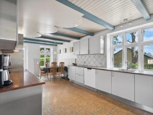 A kitchen or kitchenette at Holiday Home Essie - 20km from the sea in Western Jutland by Interhome