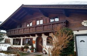 a large house with a wooden roof at The Loft in Wagrain