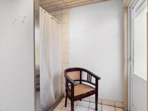 a chair in a bathroom with a shower at Holiday Home Anya - 600m from the sea in NE Jutland by Interhome in Hals