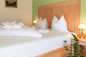 Voodi või voodid majutusasutuse dasKAISER - Dein Gartenhotel in Tirol toas