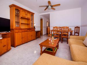 a living room with a couch and a table at Apartment Dianium-1 by Interhome in Denia