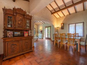una sala de estar con un gran armario de madera y una mesa. en Villa Ténérife by Interhome, en Cavalaire-sur-Mer
