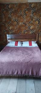 מיטה או מיטות בחדר ב-Guesthouse Omalo