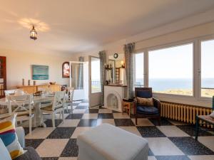 a living room with a view of the ocean at Apartment Chantelyre-1 by Interhome in Carqueiranne