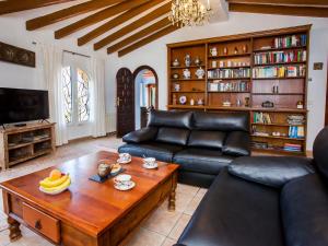 a living room with a couch and a coffee table at Villa Azul Mediterraneo by Interhome in Jávea