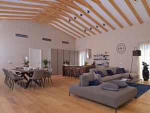 a living room with a couch and a table at Villa Vigneto by Interhome in Brtonigla