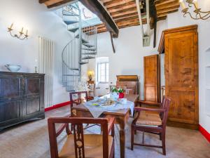 a dining room with a table and some chairs at Apartment Torre 4 by Interhome in Stigliano