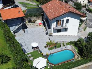 an aerial view of a house with a swimming pool at Casa Charlie in Arcisate