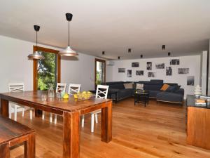 a living room with a table and a couch at Holiday Home Villa Baraka by Interhome in Božava