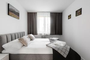 En eller flere senger på et rom på Apartament Central Zakopane