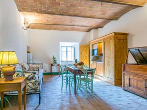 a living room with a table and a couch at Apartment Torre 2 by Interhome in Stigliano
