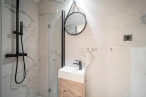 a bathroom with a sink and a mirror at Charming apartment for 4 people - Forville - 100m from the Old Port in Cannes