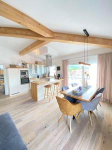 a kitchen and dining room with a table and chairs at Penthouse in Sonthofen in Sonthofen