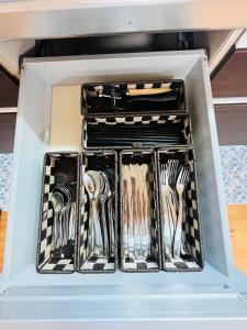 a drawer full of utensils in a drawer at 白浜リゾート・源 in Kanayama