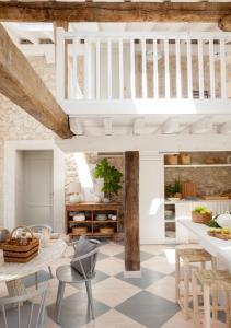a living room with a table and chairs at Wishome-Cuadra rehabilitada, piscina climatizada in Lamadrid