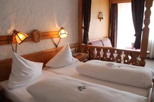 En eller flere senge i et værelse på Hotel Sonnenblick