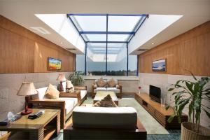 a large living room with a large skylight at Seagull Hotel Ltd in Cox's Bazar