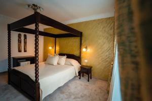 Voodi või voodid majutusasutuse Pensiunea Alessia Soveja toas