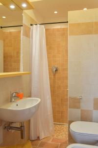 Een badkamer bij Al Riparo Affittacamere