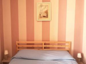 Postel nebo postele na pokoji v ubytování Giovi Guesthouse