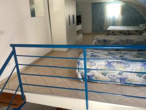 a room with two beds and a table in a room at Capricornio Club Diffuso in Maiori