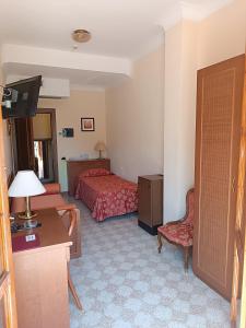 Postel nebo postele na pokoji v ubytování Hotel Ipanema