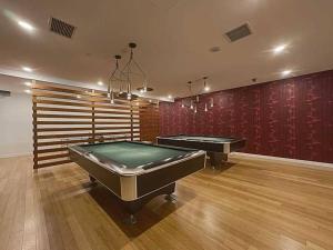 a large room with two pool tables in it at Downtown Toronto Condo Suite in Toronto