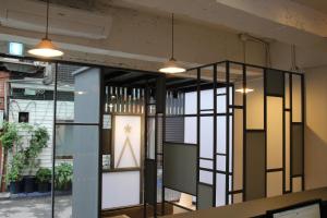 a room with glass doors and a window at Starhostel Dongdaemun Suite in Seoul