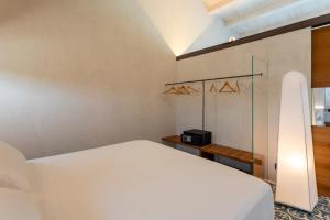 Letto o letti in una camera di SampieriSuite
