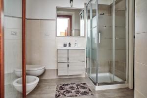 a bathroom with a shower and a toilet and a sink at House Matteo La Punzesa in Santa Teresa Gallura +14 photos