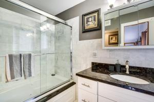 a bathroom with a glass shower and a sink at Lakefront New York Abode with Deck, Grill and Fire Pit in Mahopac +18 photos