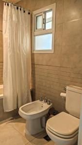 a bathroom with a toilet and a sink at BELGRANO 124 - CORRIENTES in Corrientes