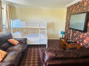 a living room with a couch and a bunk bed at One Bedroom Apartment with Balcony at Colliford Tavern & Holiday Site in Bodmin