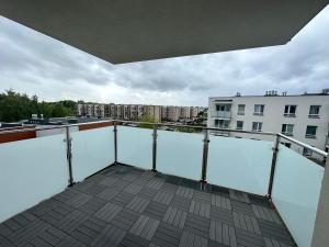 a balcony with a view of a building at SDH 4 Radzymin comfortable apartment near Warsaw in Radzymin