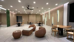 a restaurant with tables and chairs and tables and tablesktop at Panoramic KL View @Robertson Bukit Bintang 40f in Kuala Lumpur +86 photos