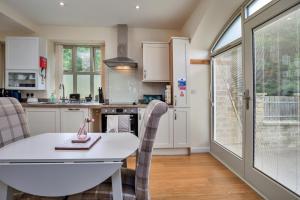 a kitchen and dining room with a table and chairs at Finest Retreats - Victory Mill - Apartment Five in Pickering +15 photos