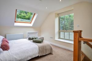 a bedroom with a bed and a window at Finest Retreats - Victory Mill - Apartment Five in Pickering