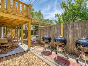 a backyard with two large bbq grill at 7 Seas Unit 4 in Tybee Island