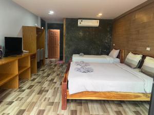 พบรักรีสอร์ท Pobruk resort客房内的一张或多张床位