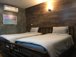 พบรักรีสอร์ท Pobruk resort客房内的一张或多张床位