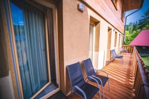 Balkón nebo terasa v ubytování Wellness & Spa Hotel Čertov