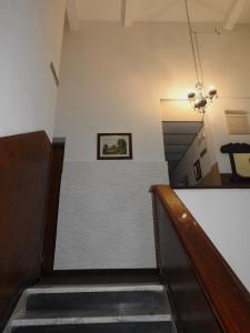 a hallway with stairs and a picture on the wall at Hotel Ideal in Montevideo