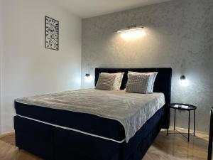 Krevet ili kreveti u jedinici u okviru objekta Aster Apartments
