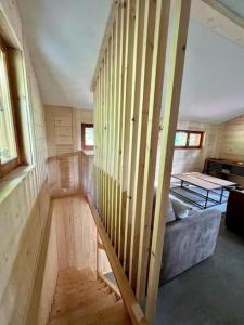a room with a staircase in a tiny house at Chalet la parenthèse in Le Tholy