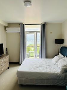 Katil atau katil-katil dalam bilik di Seaview Sunset Accommodation