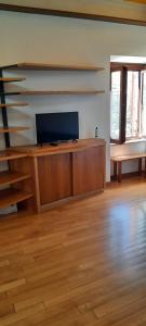 a living room with a flat screen tv on a wall at Oasi in Poggio Moiano